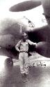 WW2 Fighter Ace Charles W. King standing in front of his P-38 Lightning.