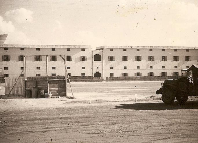 The Canning Road Barracks in New Delhi, India, where the enlisted men of the 835th Signal Service Battalion were quartered. The softball field is shown in the foreground. 